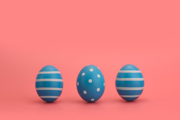 Three blue decorated eggs in a row on pink background. Happy Easter card. Blue Easter painted eggs...