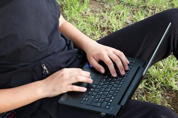 boy working with computer from home by covid-19