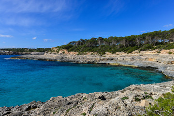 Fototapeta na wymiar Turquoise waters of a bay in the Mondrago Natural Park, Mallorca, Spain