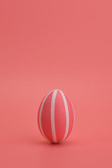 Monochrome Easter. Pink striped egg on a pink background. Pink egg with white stripes stands...