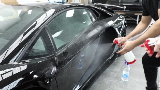 Spaying on exotic car before Paint Protection Film installation