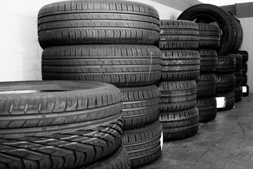 black and white overview of new tires in a tire workshop