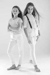 Fashion kids. Children's Mado. Black and white photo of little girls.