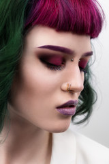 Fototapeta premium Beautiful woman with purple green professional colored hair