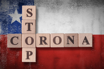 Flag of Chile with wooden cubes spelling STOP CORONA on it. 2019 - 2020 Novel Coronavirus (2019-nCoV) concept art, for an outbreak occurs in Chile.