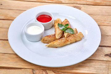 pancakes with sour cream and berry sauce