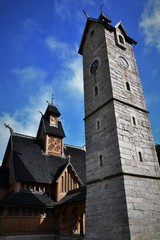 wooden old church and stony tower