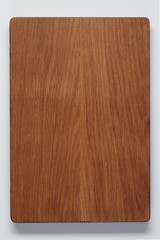 Handmade brown oak chopping board on white background, culinary background