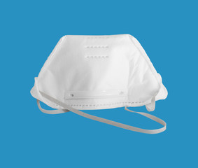 White anti pollution mask for protection from corona virus(COVIT-19) isolated on blue