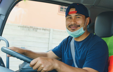 The smile of a professional truck driver in a long transportation	