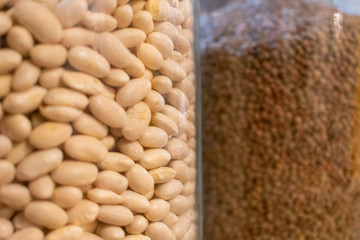 legumes in glass jars in a kitchen