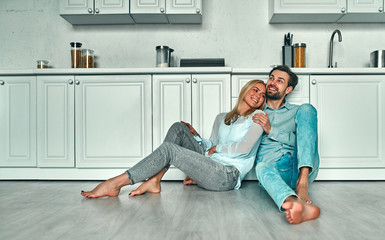 Couple in kitchen.