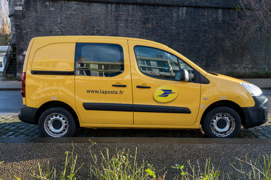 Calais, France - December 18, 2019 : La Poste Yellow Parcel Delivery Service Van (Citroen Jumpy) Parked In The Street. La Poste Is A Postal Service Company In France.