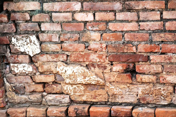 16 Old orange brick wall with breaks in a Buddhist temple