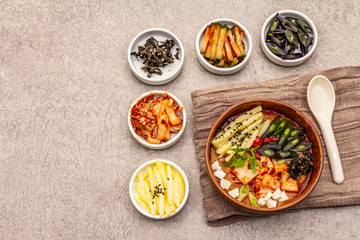 Traditional Korean spicy soup with kimchi, tofu, vegetables. Hot dish for healthy meal