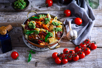 Pasta with Grilled Eggplant, Smoky Tomato Sauce and Basil Walnut Pistou .style rustic.selective focus