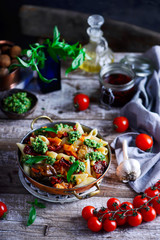 Pasta with Grilled Eggplant, Smoky Tomato Sauce and Basil Walnut Pistou .style rustic.selective focus