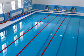 Fototapeta na wymiar Swimming pool. Empty tracks races of a sports swimming pool. Top view