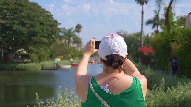 Girl Taking picture in Venice Los Angeles in 4K Slow motion 60fps
