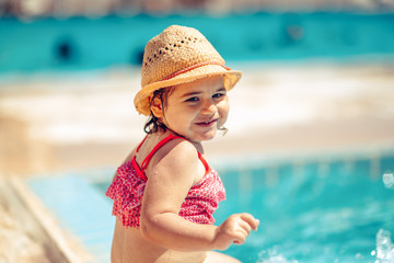 Child is enjoying in Swimming Pool. Summer Vacation having fun With Kids.