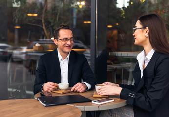 Coworkers team at work. Group of young business people in trendy casual.