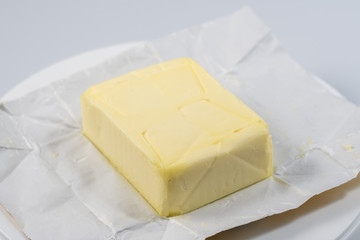 The wrapped butter is open for proper nutrition with amino acids for the normal functioning of the heart and itelect.