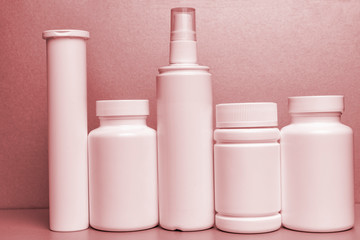 photo of five plastic cans for package pills and vitamins and antiseptic spray for protection...