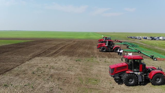 Aerial view of agricultural machinery ready to work in the field