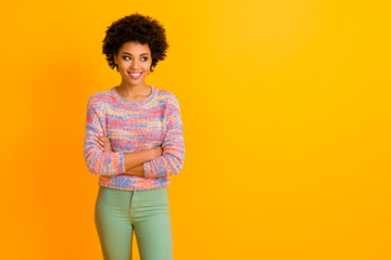 Portrait of attractive modern afro american girl cross hands listen her job friend look copy space wear stylish green trousers isolated over shine color background