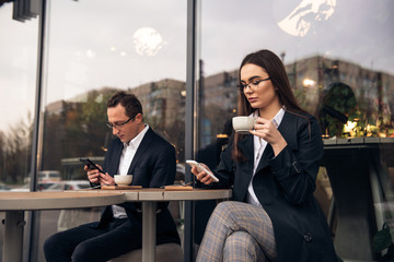Business people in cafe, working while break.