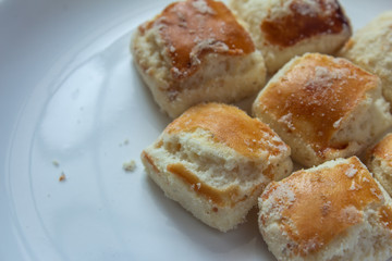 Square butter cookies in a white plate. Bakery cookies in square shape.