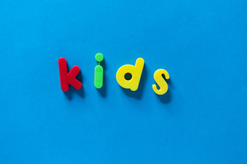 Colorful children letters spelling KIDS