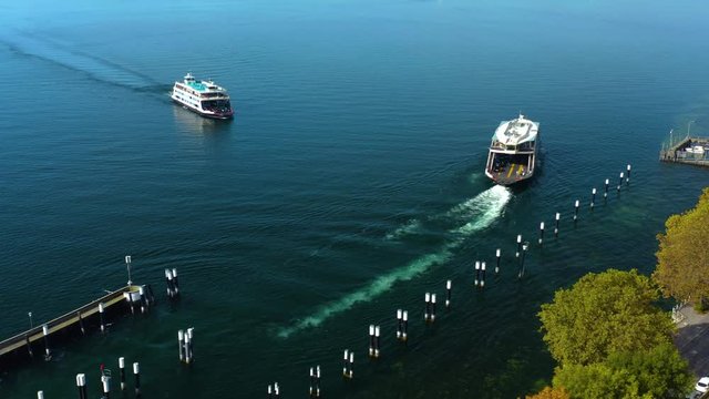 Two ferries on the bodensee in Germany leaving and coming.