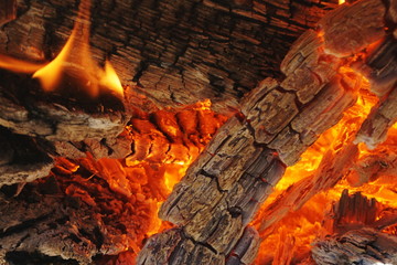 Background of burning logs in the oven, selective focus.