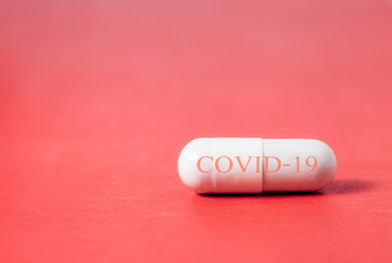 Obraz na płótnie Canvas Capsule pill Medicine Positive Coronavirus or COVID-19.Medicine Of viruses in laboratory for Prevention of a pandemic in Wuhan China. scientist in biological protective Epidemic virus outbreak concept