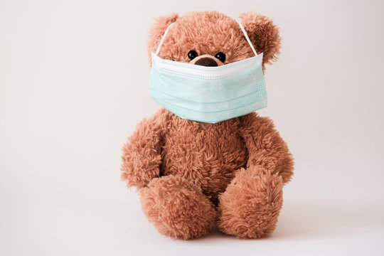 Teddy bear wearing protective medical mask. coronavirus protection. virus outbreak in a world. toy bear in mask to prevent virus spread.