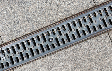 Metal cover os the sewage on the road