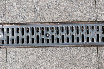 Metal cover os the sewage on the road