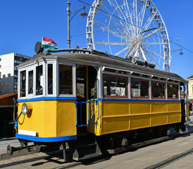 Naklejka premium Old yellow tram on the street