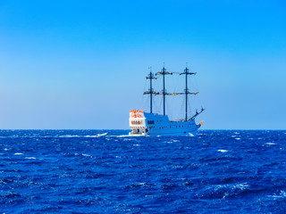 Fototapeta na wymiar A luxurious wooden sailboat in the Red Sea against the blue sky