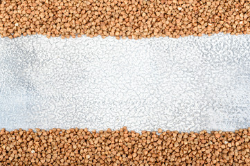 The texture of dry buckwheat. Background image of buckwheat porridge. Maro's Photo