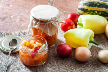 Homemade preserving. Zucchini and bell pepper salad in glass jar