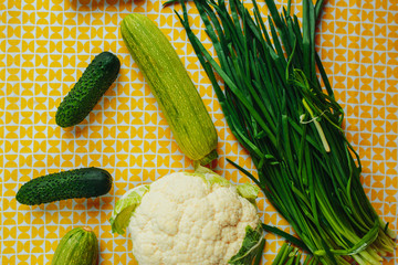 Healthy nutrition, healthy food on the table, greens and vegetables, cauliflower, cucumbers and...