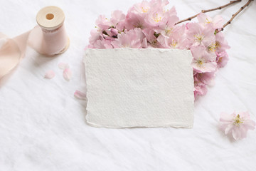 Wedding stationery mock-up scene. Blank greeting cards, envelope on linen tablecloth background...