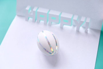 Easter time in quarantine concept. Face mask on easter eggs on the table on a white background.