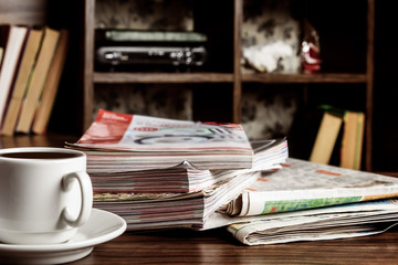 Magazines on the desk in the living room. Selective focus, toning.