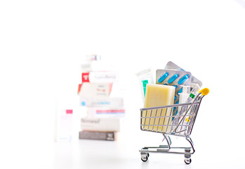 variety of pills in a supermarket trolley