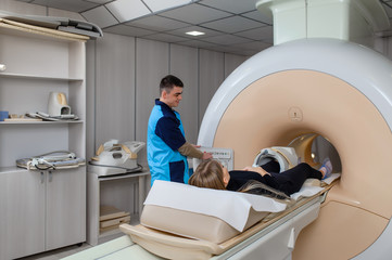 Computed and magnetic resonance imaging. CT and MRI for the diagnosis of diseases in a patient