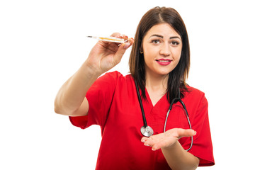 Portrait of beautiful young cardiologist showing thermometer