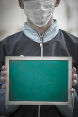 a Coronavirus Outbreak of the corona virus. Epidemic Viral Respiratory Syndrome. Plate in Man's Hands China